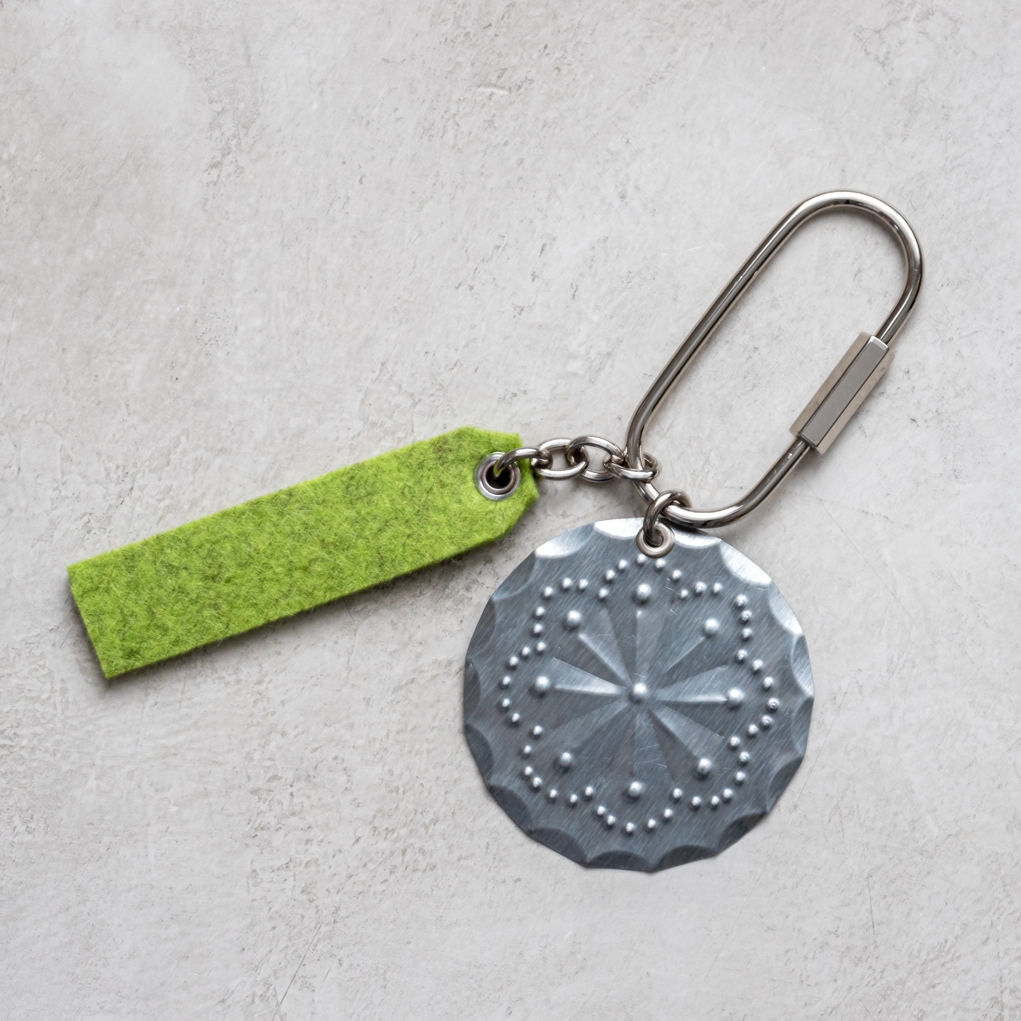 Handmade tin rosette key ring with 2.25-inch nickel ring, 3-inch felt accent, and kraft jewelry box.