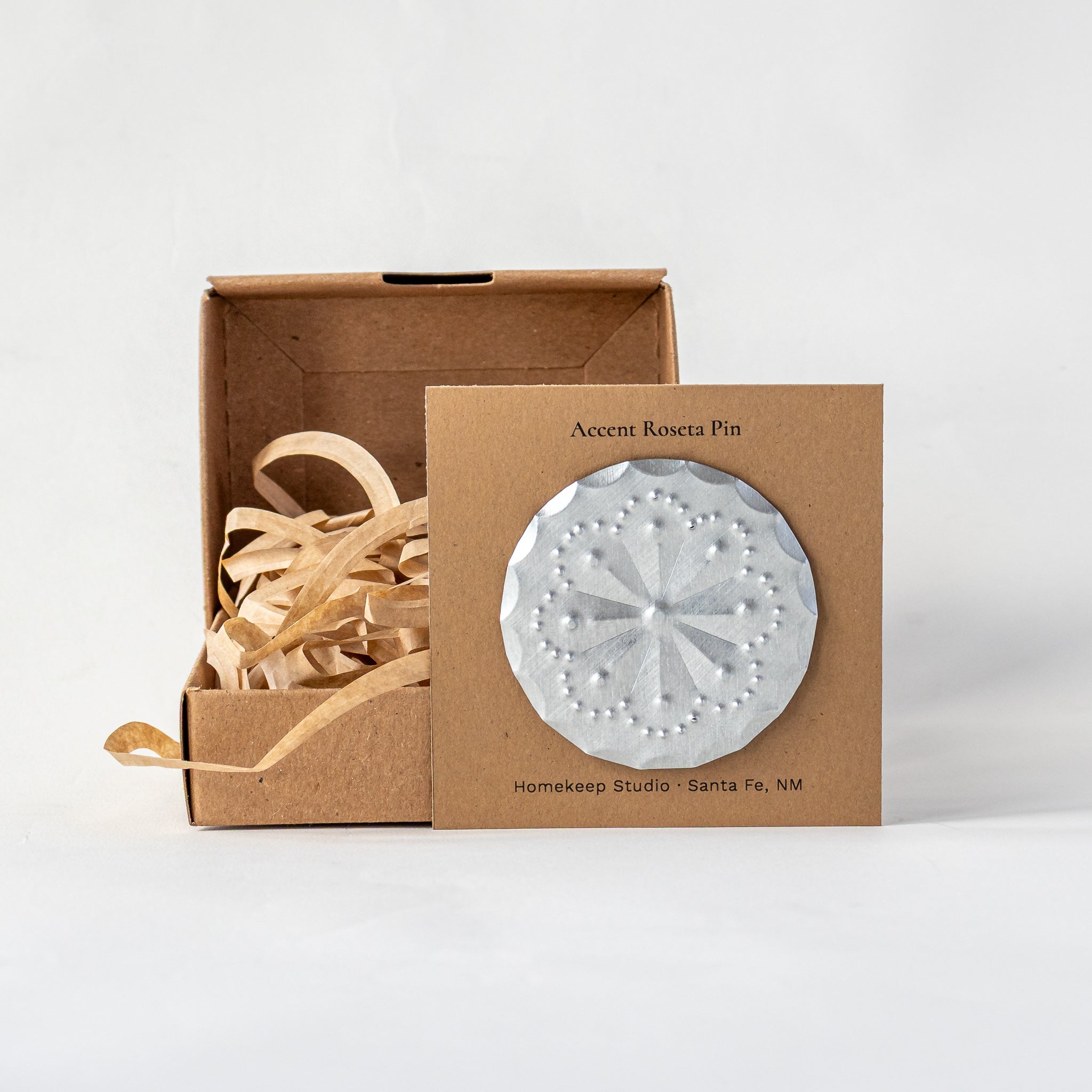 Accent Roseta Pin with magnetic back displayed on kraft card with gift box and paper fill.