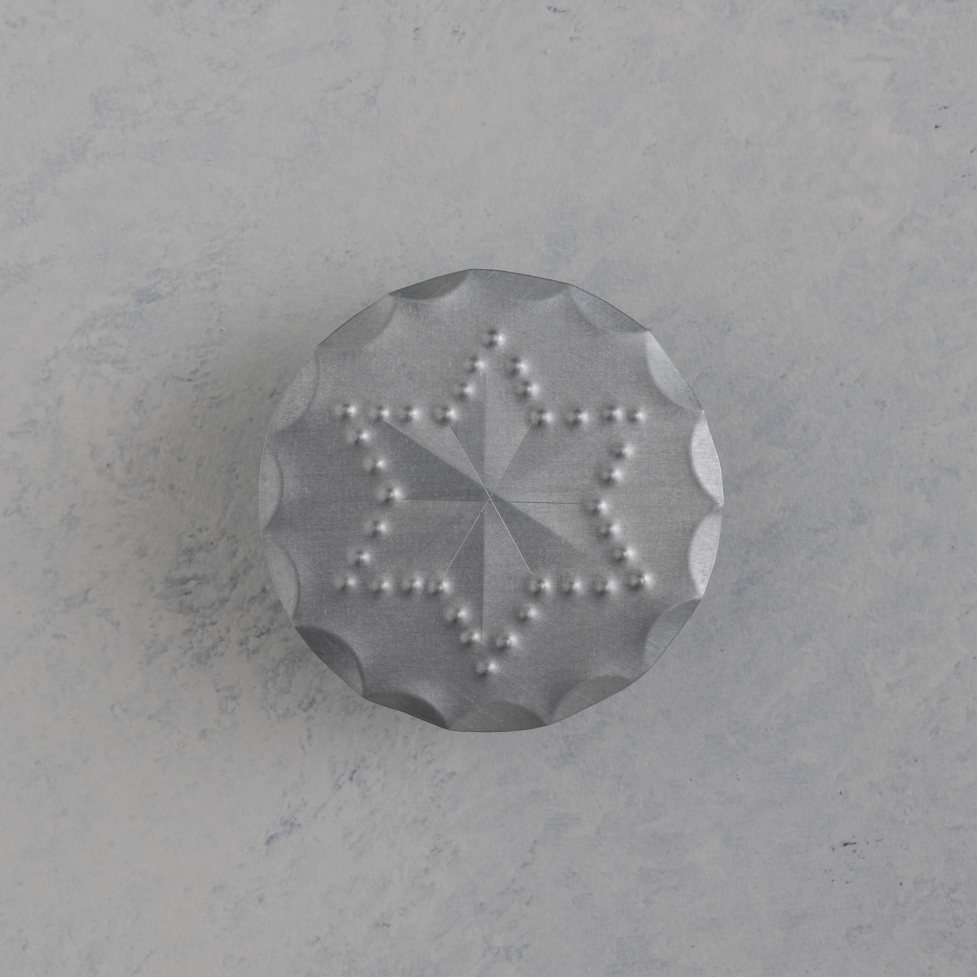 Hand punched tin bandana slide with scalloped edge and six point star motif, handmade in Santa Fe