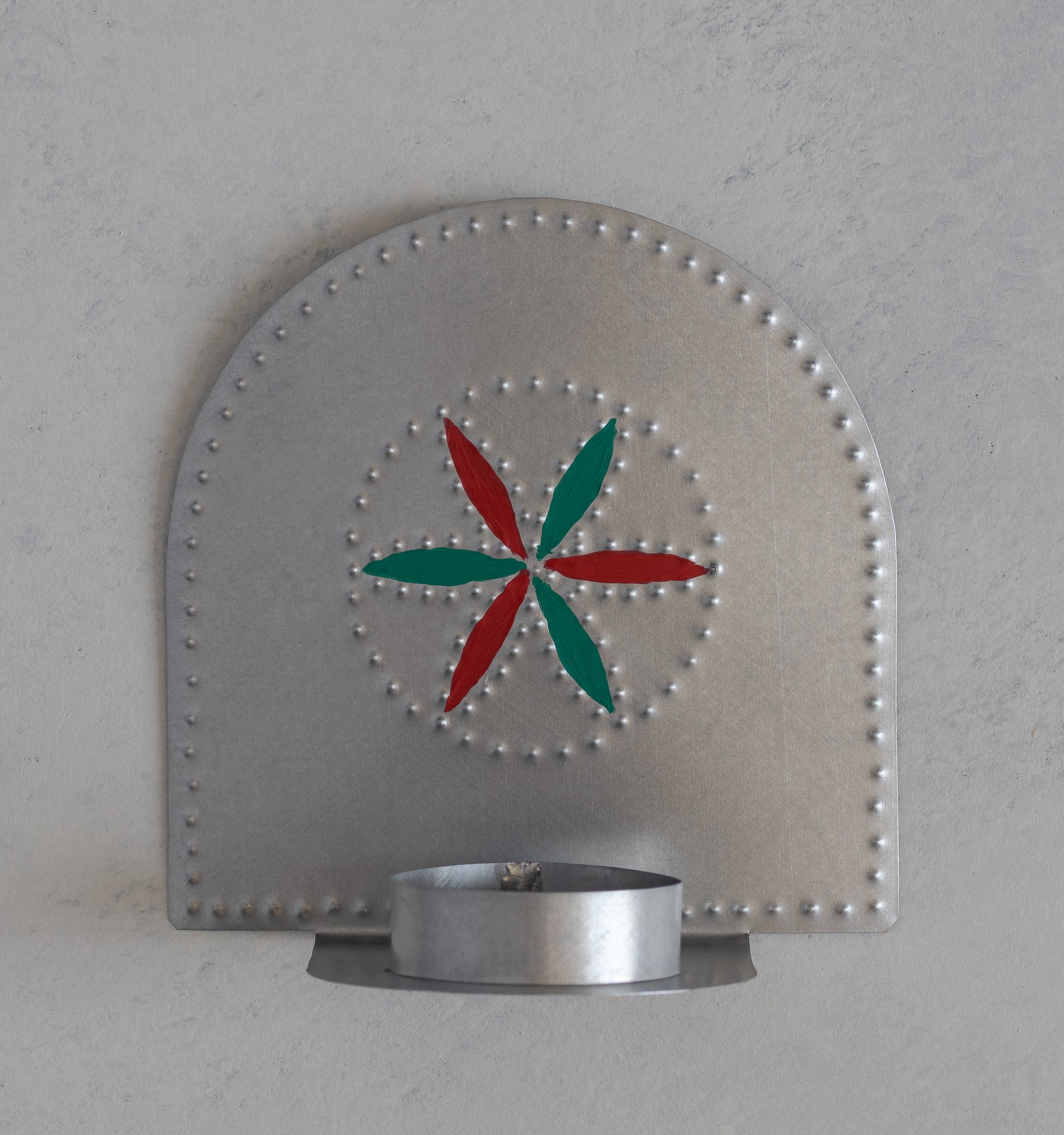Hand punched tin flor tealight candleholder with red and green hand painted detail, handmade in Santa Fe
