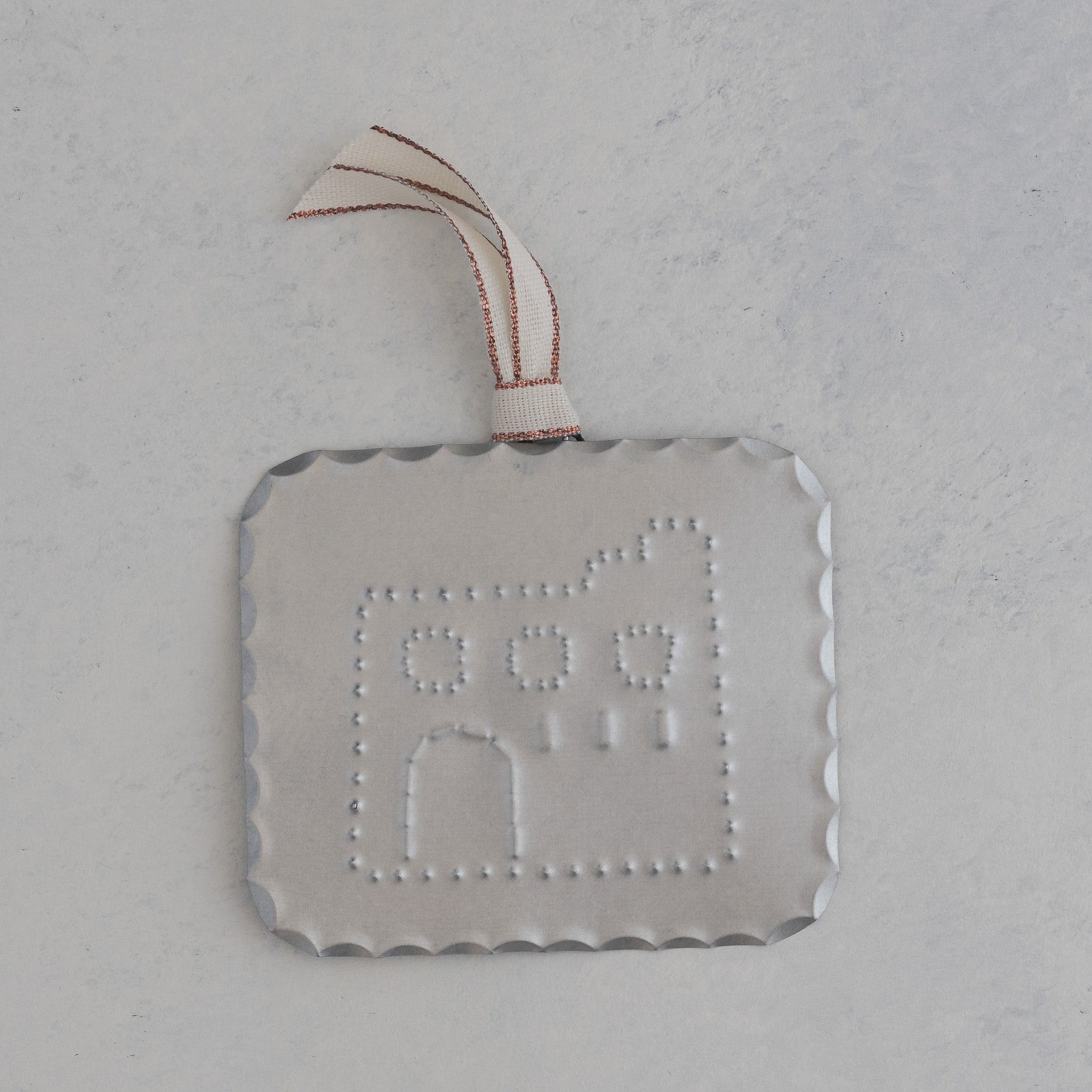 Hand punched tin house milagro ornament with scalloped edge and rose gold ribbon, handmade in Santa Fe