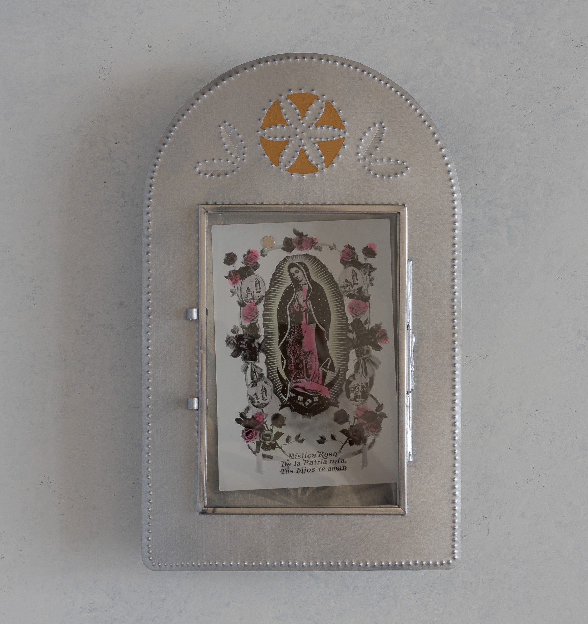 Nicho de Recuerdo in ochre painted finish, glass door open, holding a Virgen de Guadalupe devotional card, handmade in Santa Fe