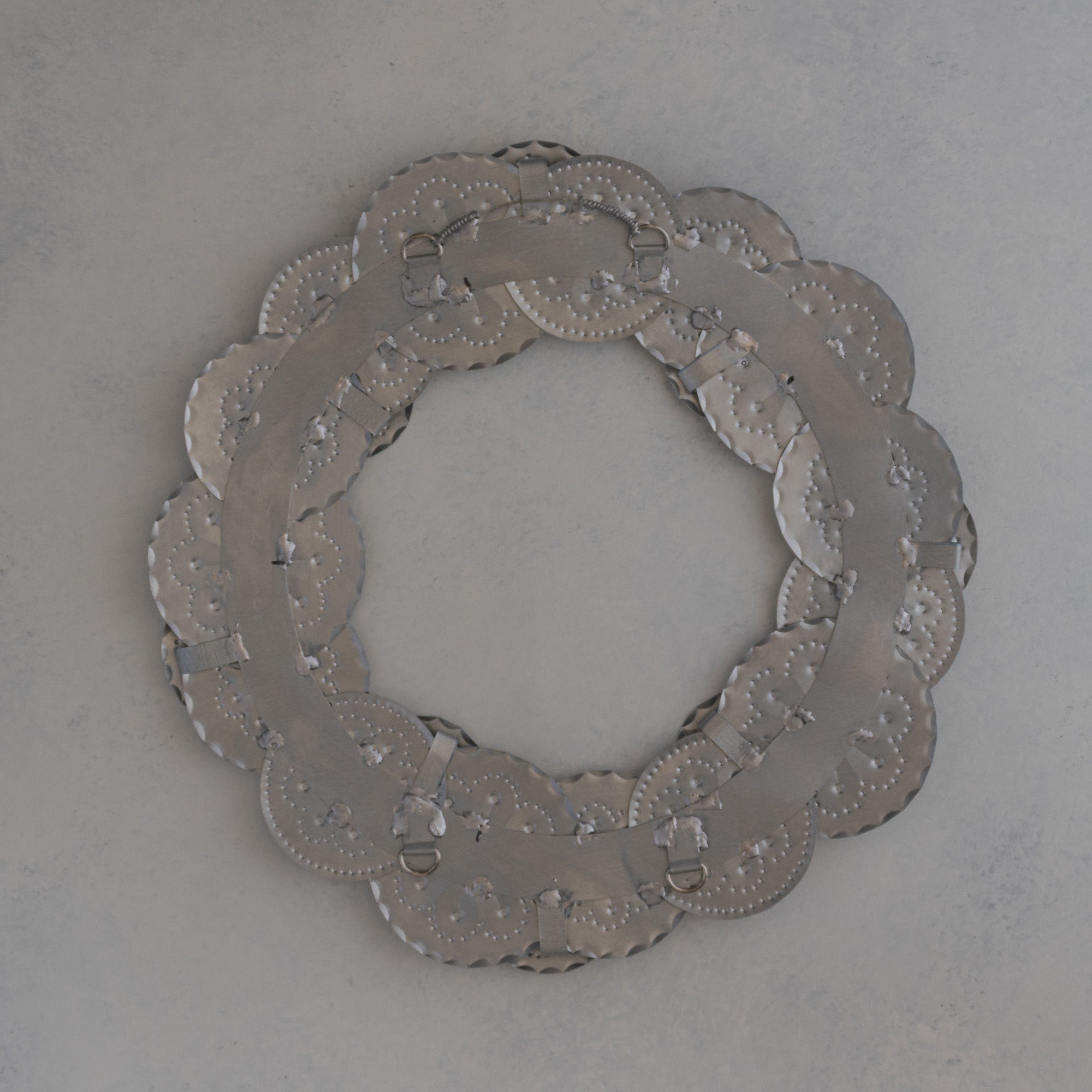 Back of the Roseta Corona wreath showing the two D-rings and hanger positions for adjustable bow placement