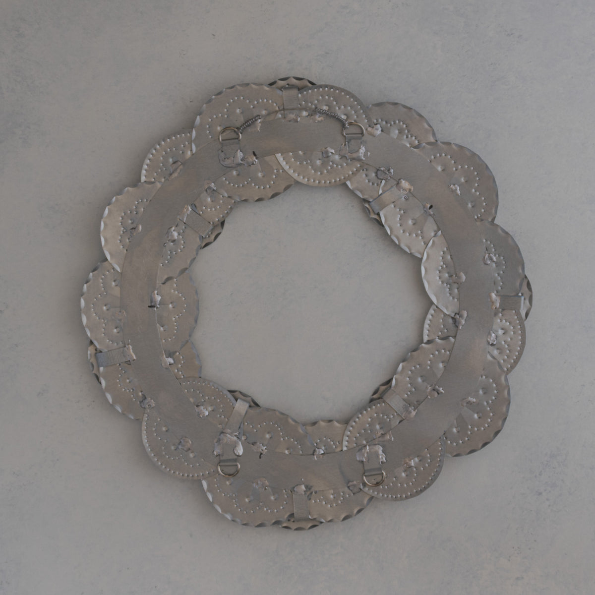 Back of the Roseta Corona wreath showing the two D-rings and hanger positions for adjustable bow placement