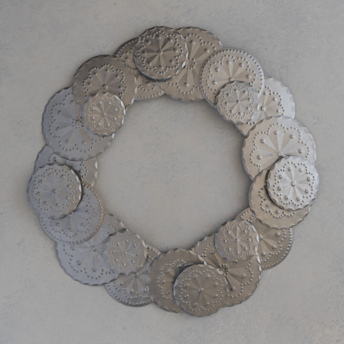 Tin Roseta Corona wreath made of 23 hand punched rosettes, handmade in Santa Fe