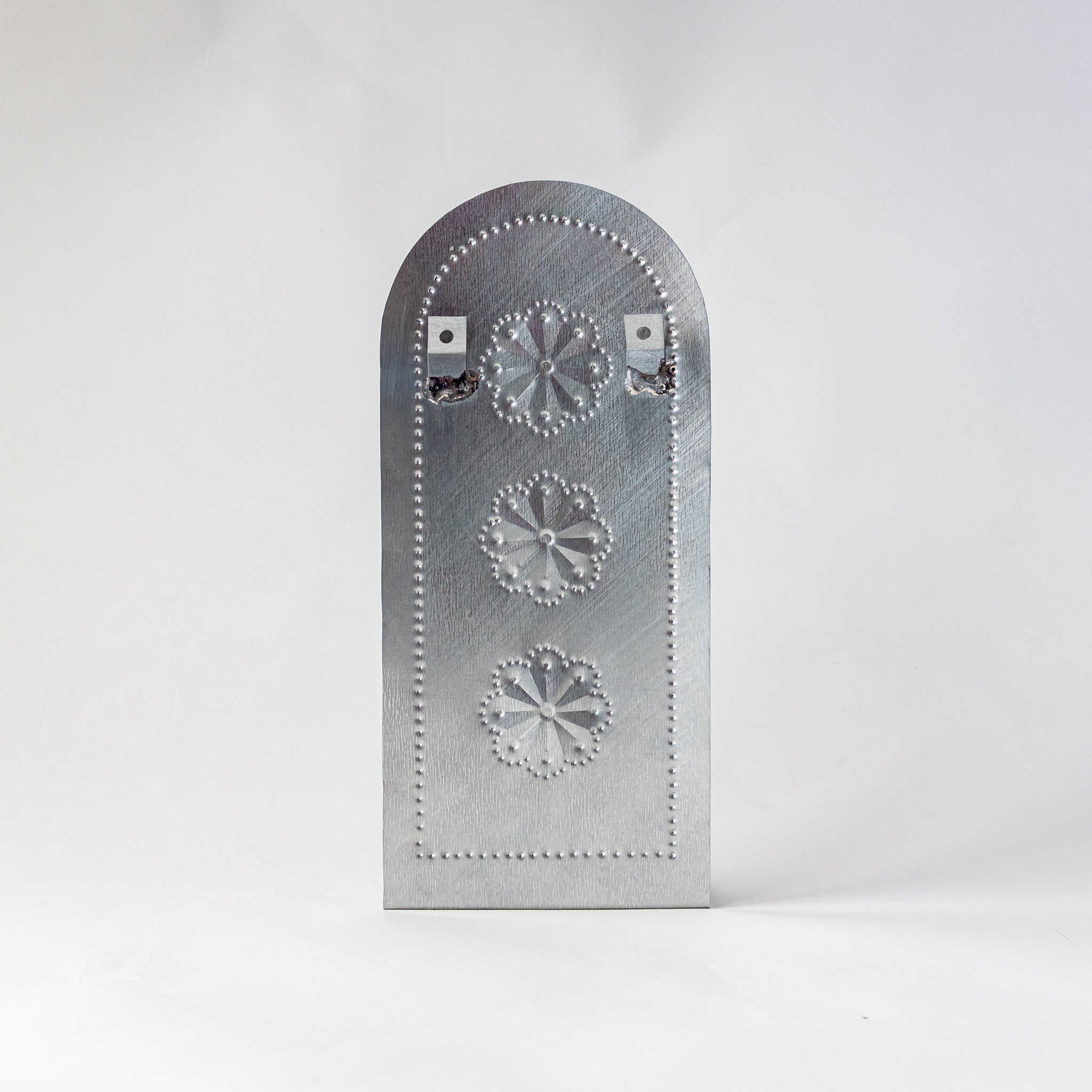 Back view of the Roseta Trio Taper Holder with hanging brackets visible.