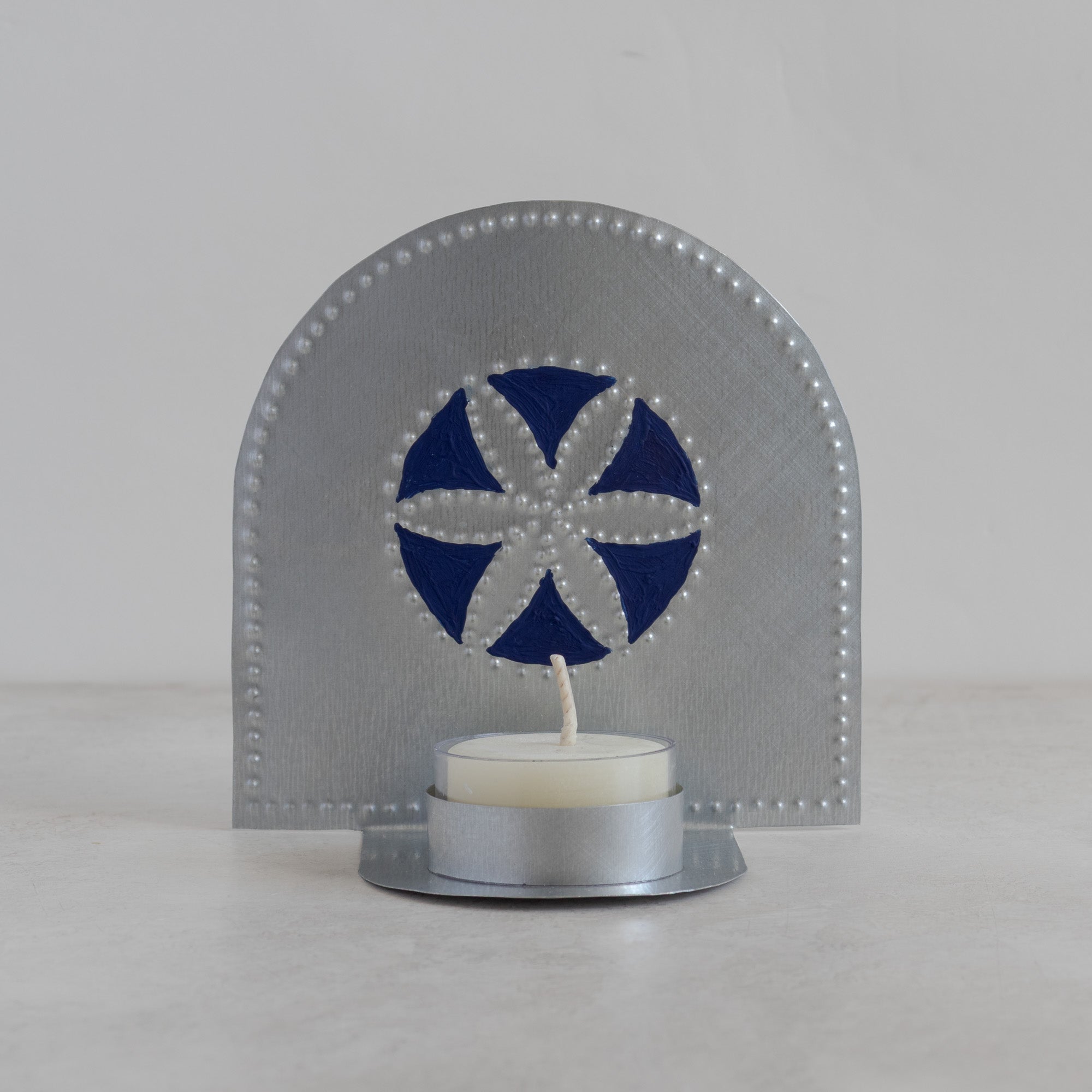 Flor tealight candleholder with hand-painted blue design and beeswax tealight candle